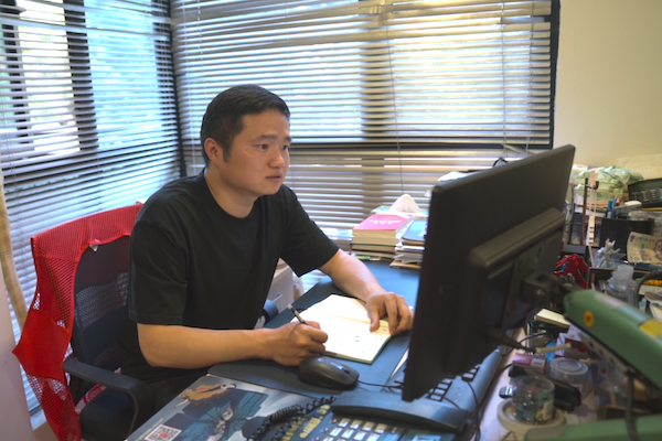 He Mu, Party secretary of Chunjiang community in Shangcheng district, Hangzhou, east China's Zhejiang Province, works in his office on June 11, 2026. (People's Daily Online/ Zhang Wenjie) 1-1-1-3.png